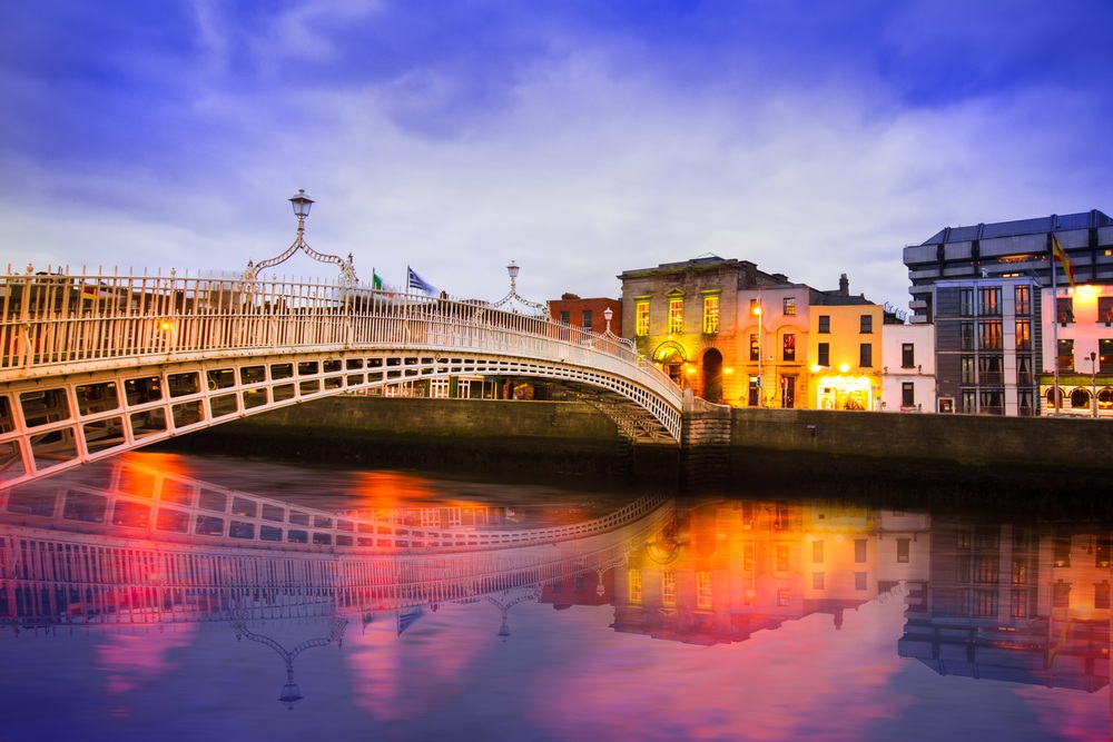 city bridge and colorful homes in the evening